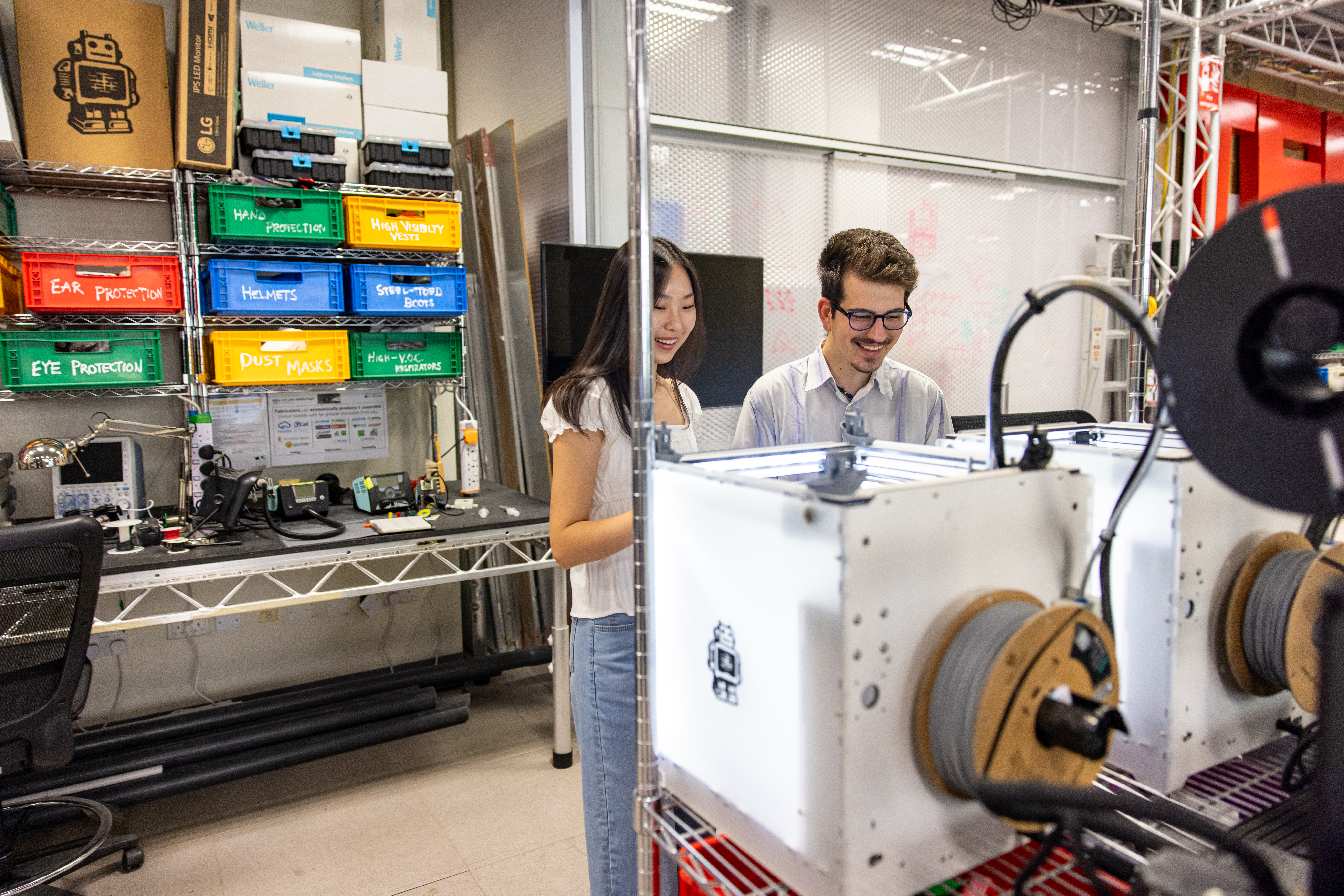 Two students working together in an engineering lab.