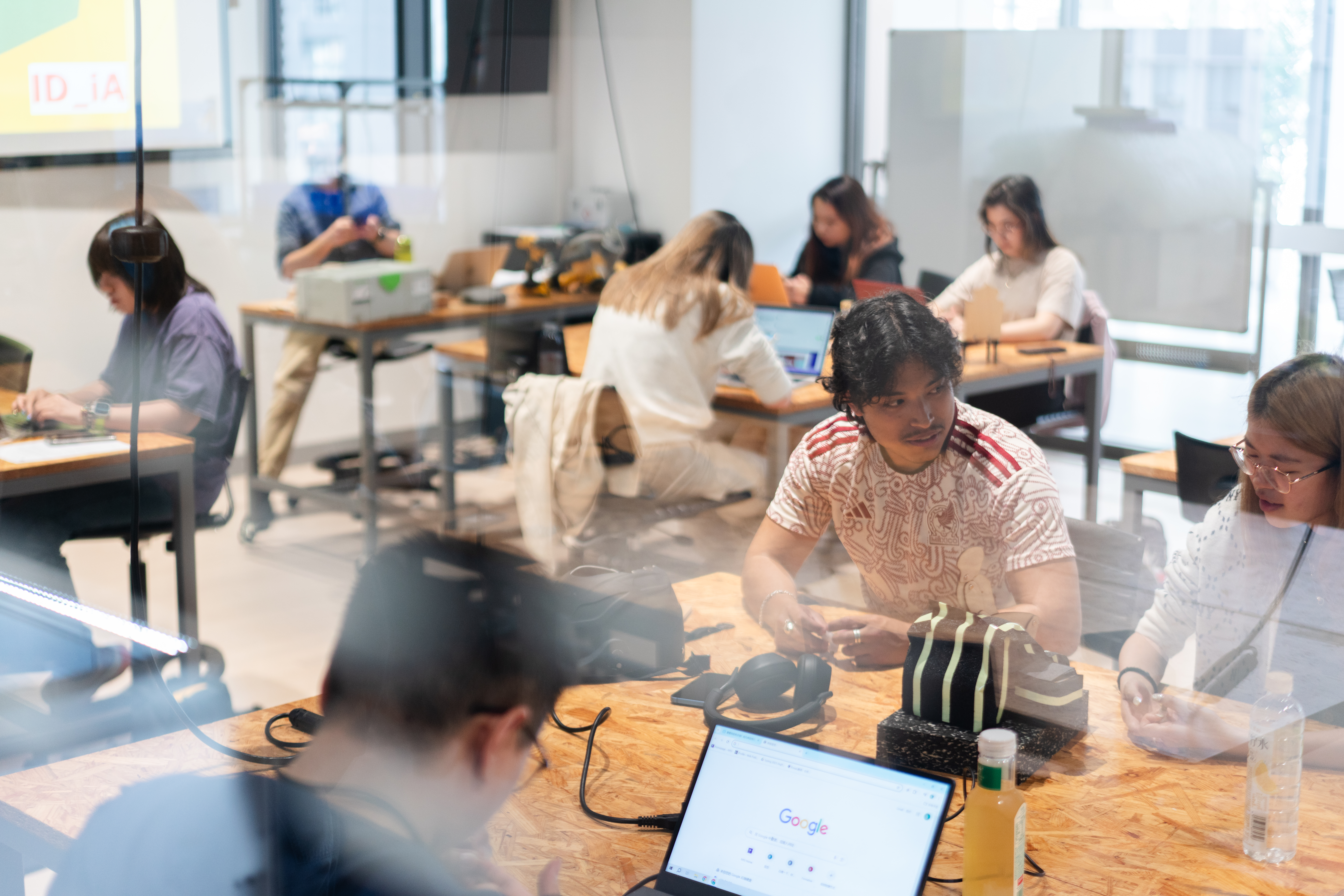 Students seated and working together in a classroom.