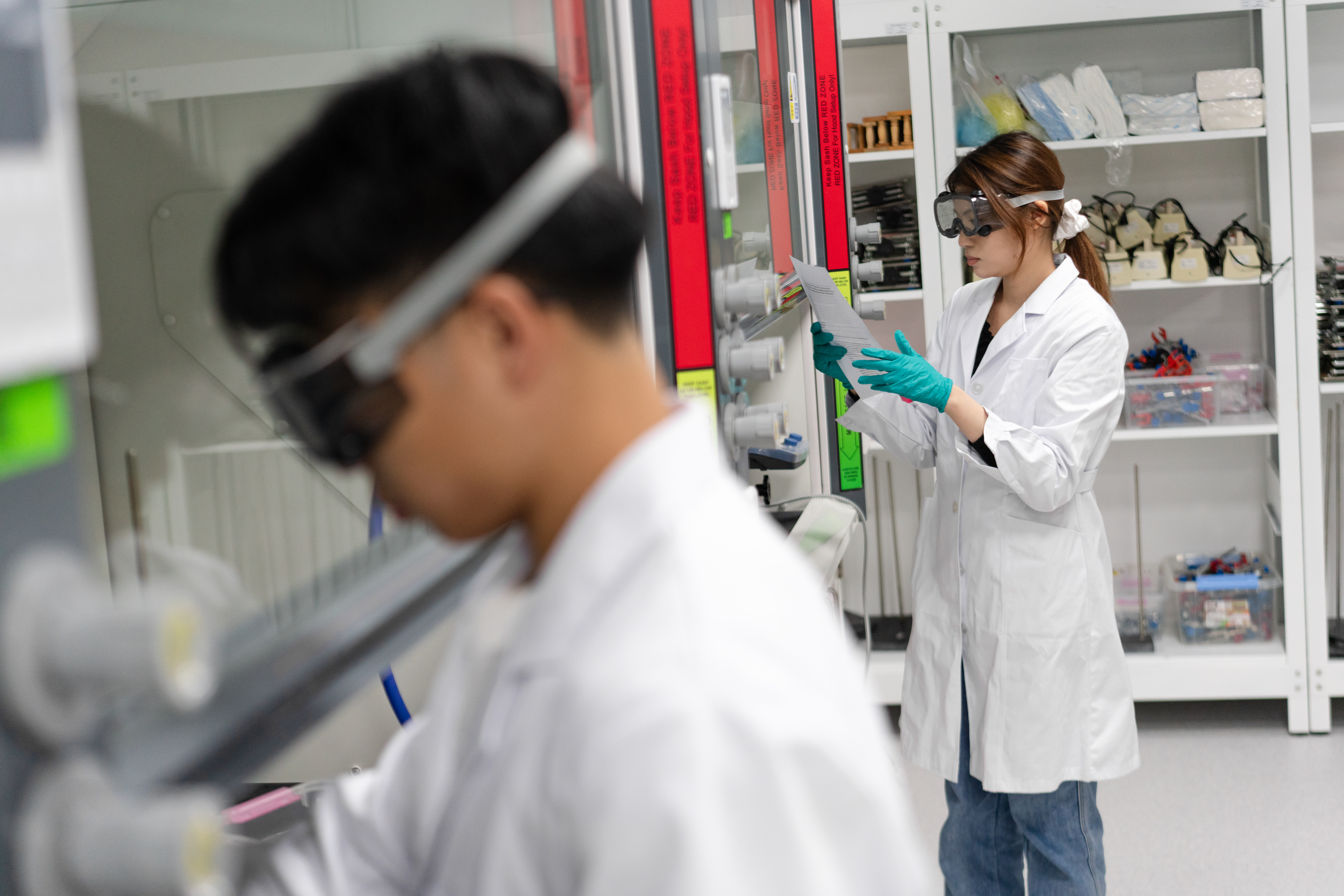 Two students working in a science lab.