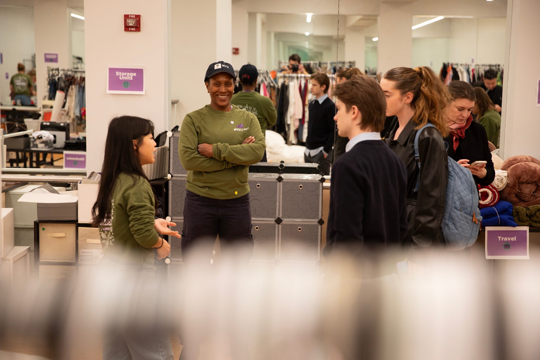NYU Grounds worker chats with students at the mini Swap Shop.