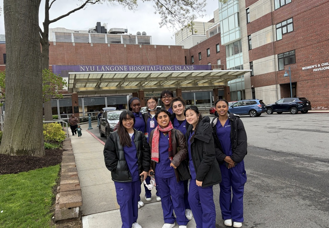Emmaley Abreu and a group of students outside a NYU Langone Hospital