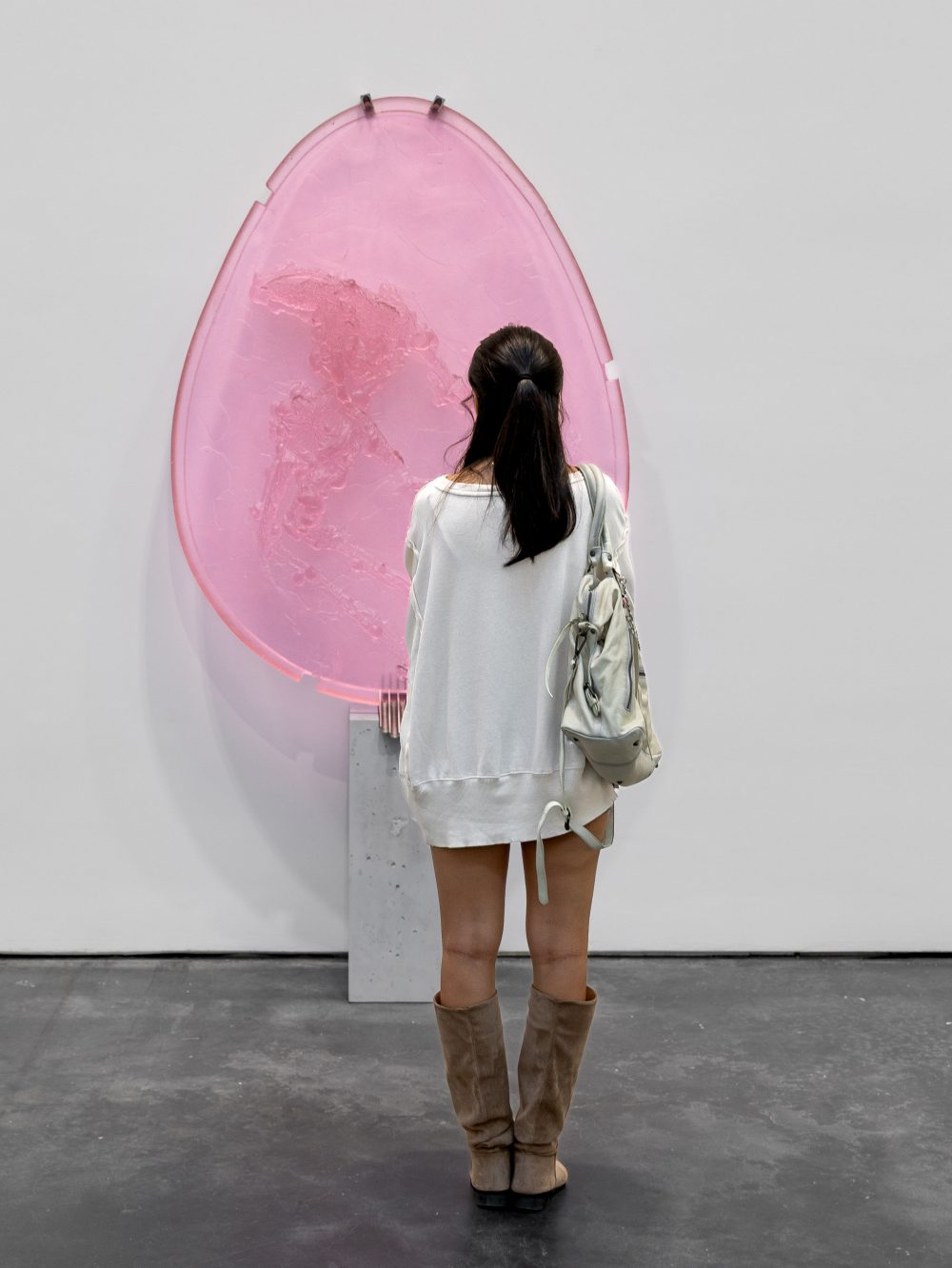 A student looking at a work of art