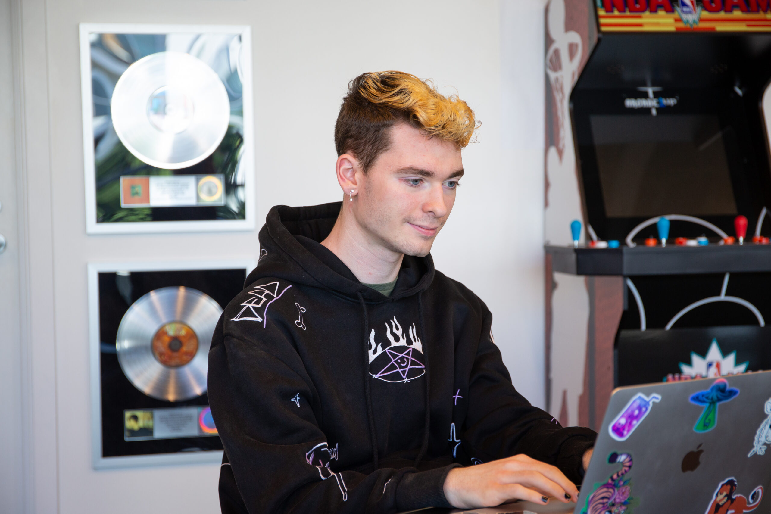 A student at their internship at a recording studio