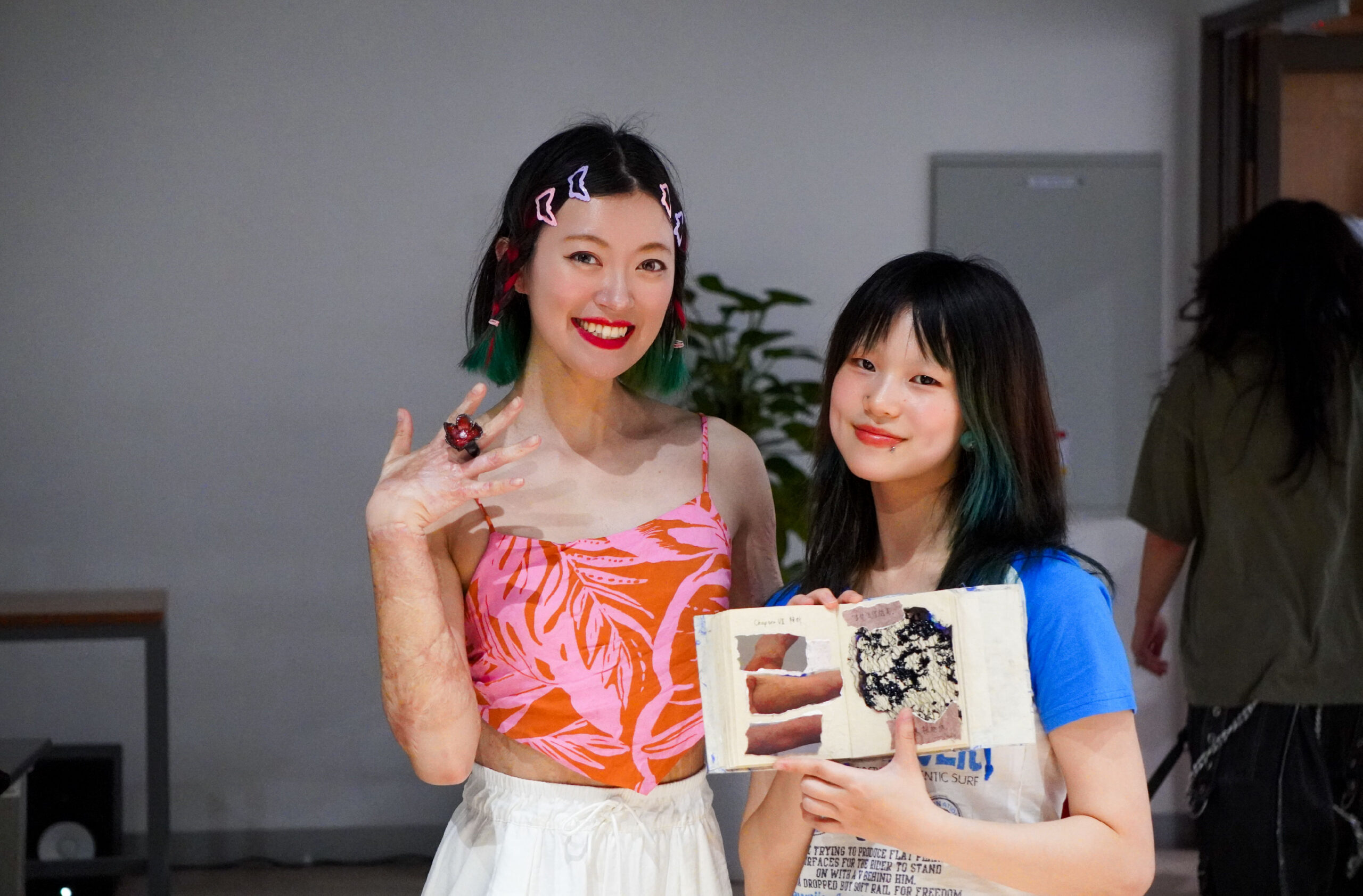 Sophia (right) with Nelly, a participant in her “scar story” project