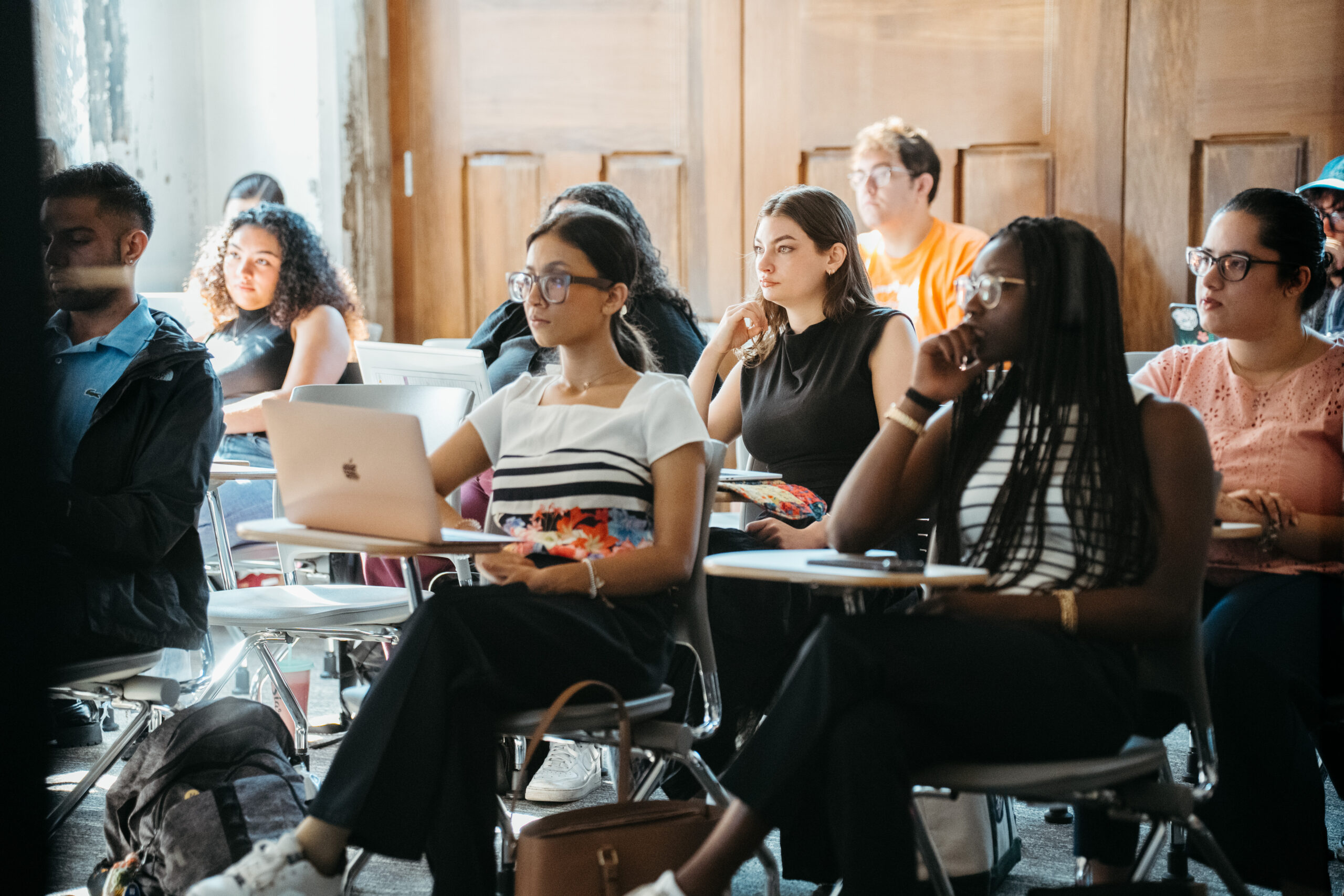 A group of students listening intently in class.