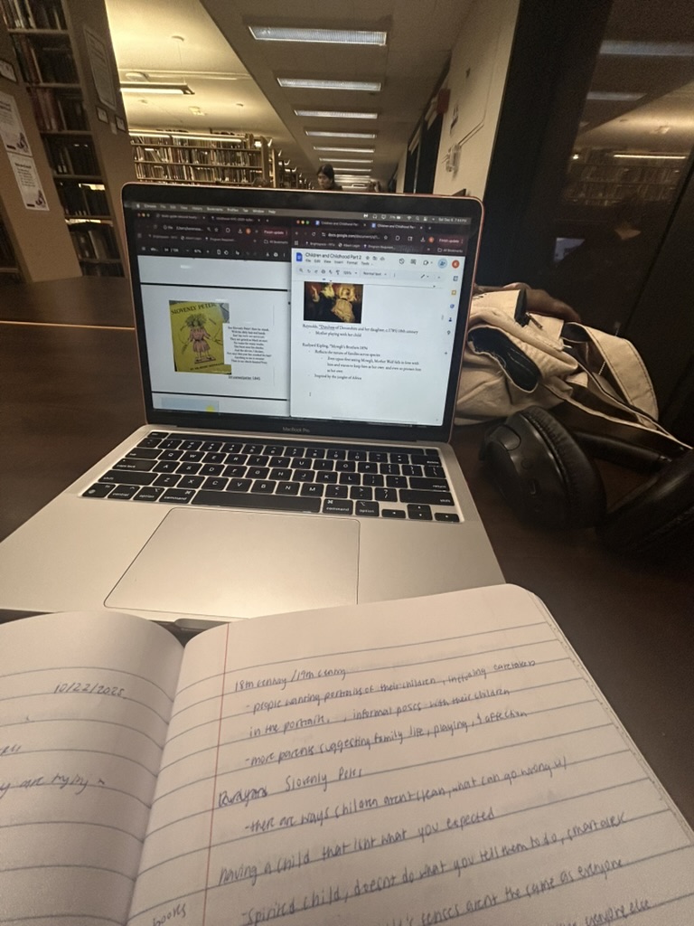 Image of laptop and notebook with notes